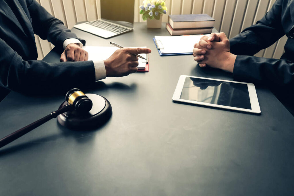 Lawyer consulting with client regarding personal injury lawyer