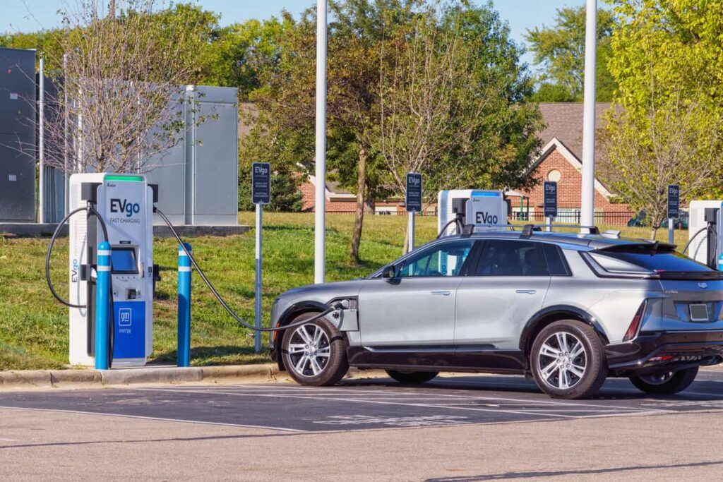 Electric vehicle charging at an EVgo station, highlighting the potential dangers of crashing into electric vehicles.
