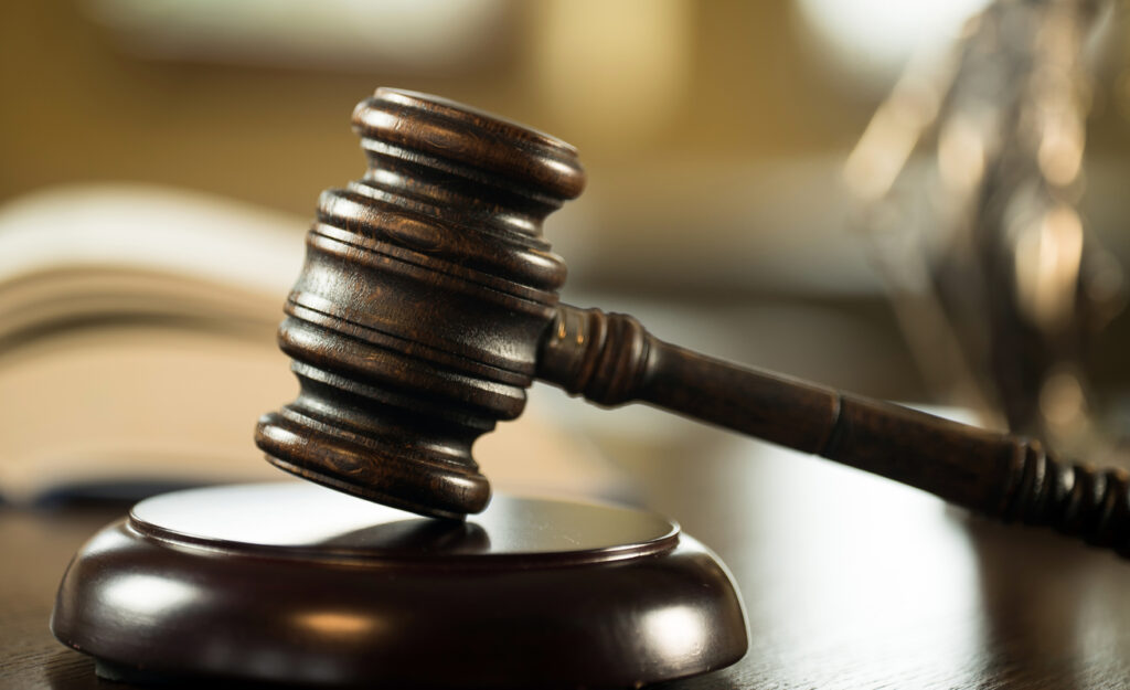Mallet of the judge, books, scales of justice. 